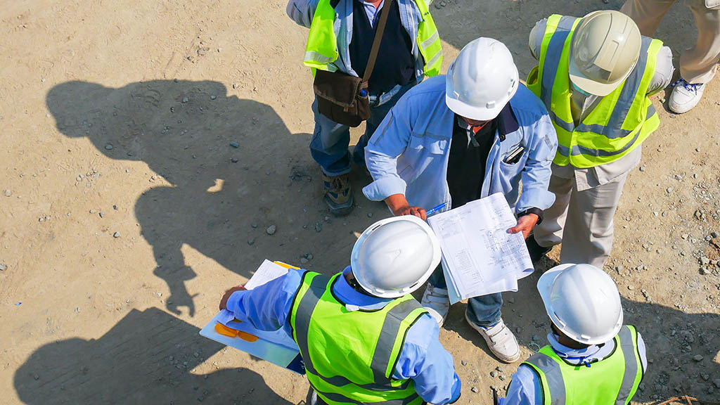 Aerial view group of construction worker meeting at construction site
